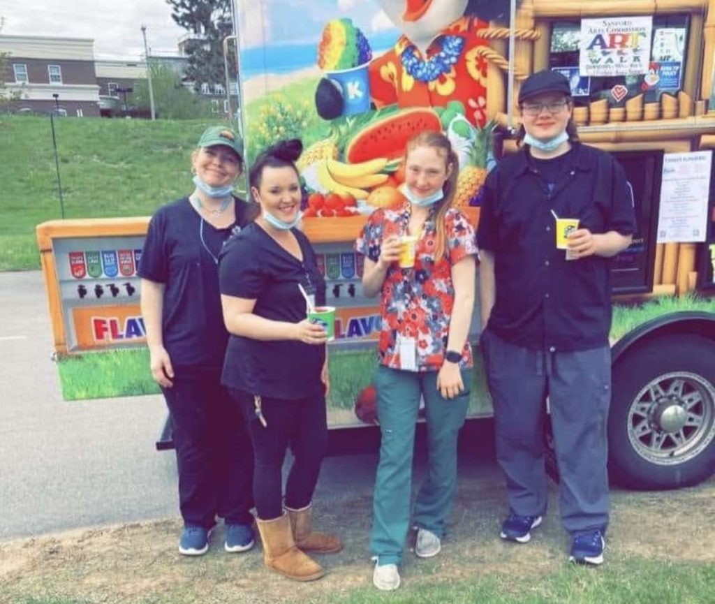 Summer Commons staff members enjoy Kona Ice treats.