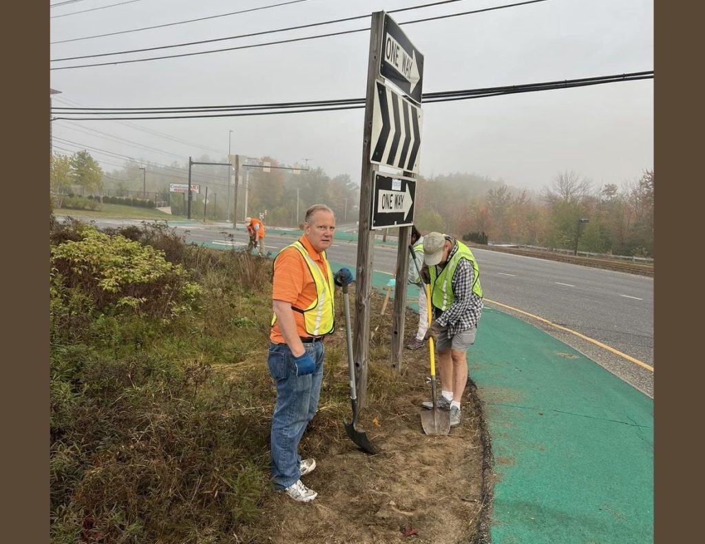 Members of the Rotary Club of Sanford-Springvale work on the roundabout.