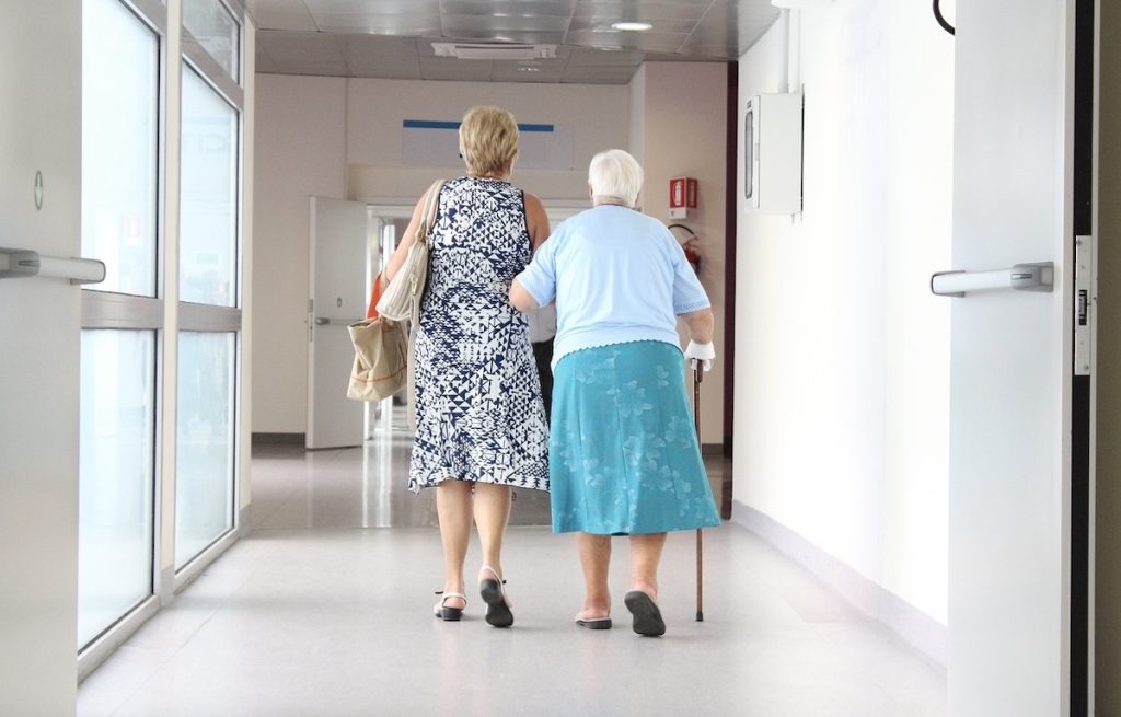 women wlking down a hallway