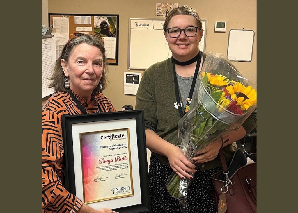 Tanya Butts (right), patient service representative at Nasson Health Care, is presented with the organization’s Employee of the Quarter award by Barbara Crider (left), interim chief operating officer.